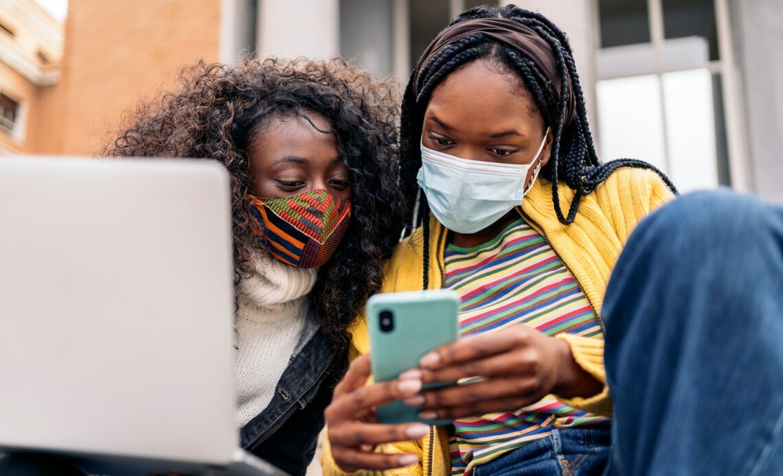 Cool Afro Girls Using Phone
