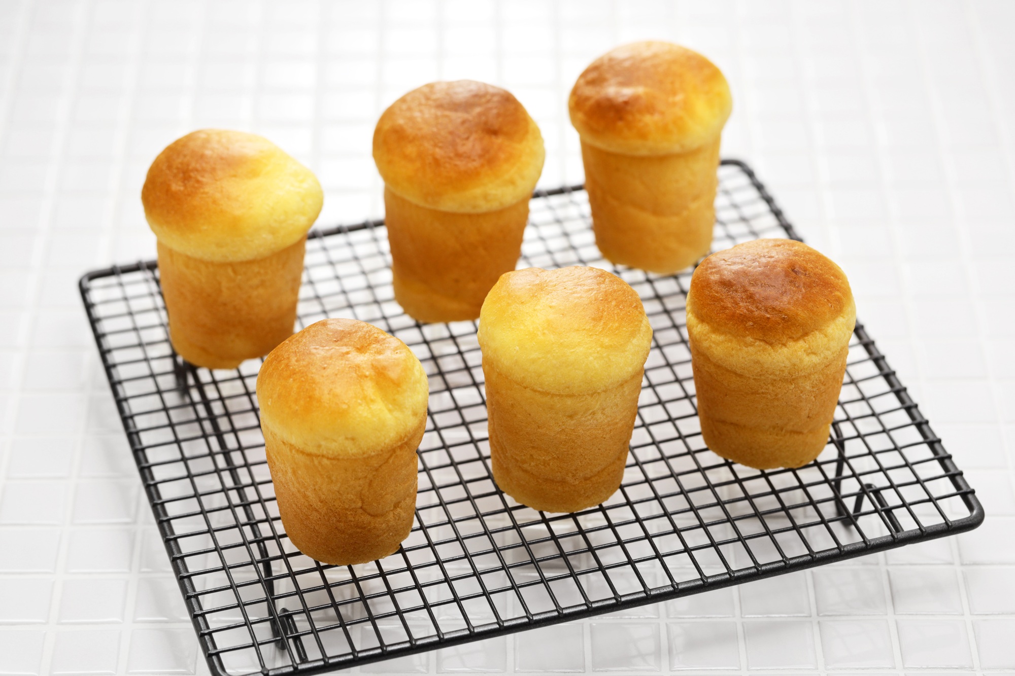 making rum baba ( baba au rhum ), traditional French and Italian dessert